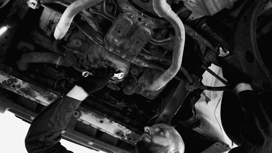 Skilled mechanic working on vehicle repair demonstrating professional expertise